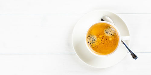 Directly above shot of coffee cup on table