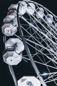 Low angle view of ferris wheel against sky