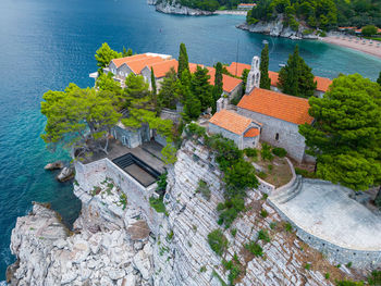 High angle view of townscape by sea