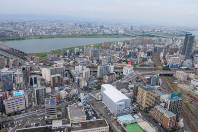 High angle view of modern buildings in city against sky