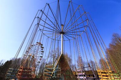 Low angle view of ferris wheel against sky