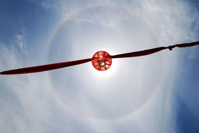 Low angle view of red wall against sky