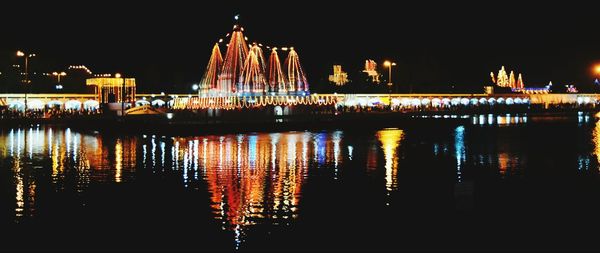 Reflection of illuminated buildings in water
