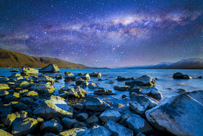 Scenic view of sea against sky at night