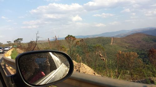 Reflection of road in side-view mirror