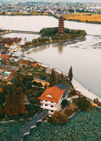 High angle view of buildings by lake