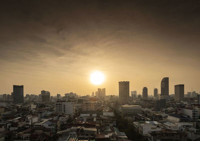 Cityscape against sky during sunset