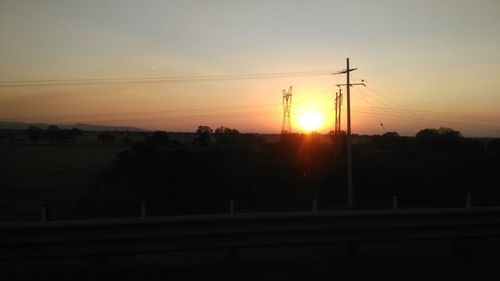 Silhouette trees against sky during sunset