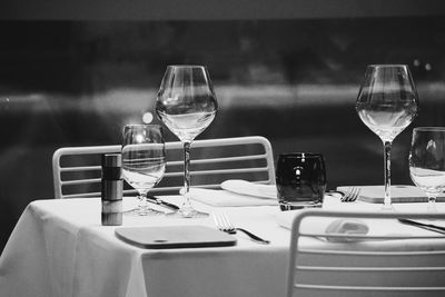 Close-up of place setting on table at night