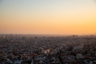 High angle view of buildings against sky during sunset