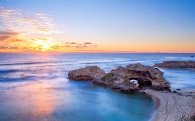 Scenic view of sea against sky at sunset