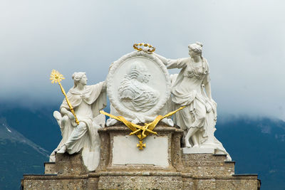 Low angle view of statue against sky