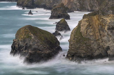 Scenic view of rocks in sea