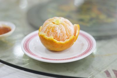 Close-up of orange fruit in plate