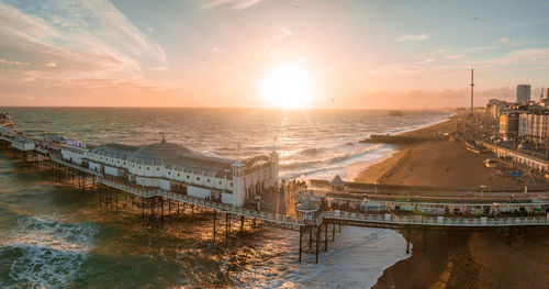 Aerial view of brighton palace pier, with the seafront behind.