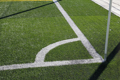 Shadow of woman on soccer field