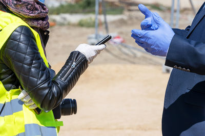 Low angle view of man using mobile phone