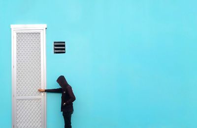 Man knocking door of house