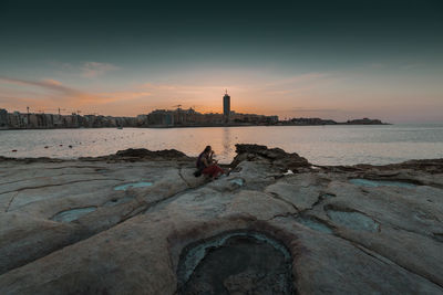 Scenic view of sea against sky during sunset