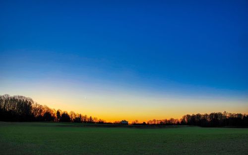 Scenic view of silhouette landscape against clear sky at sunset