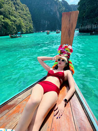 Rear view of young woman in swimming pool