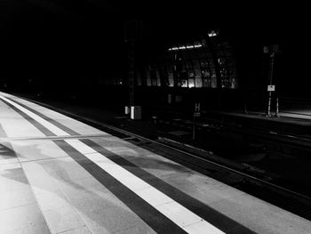 Railroad station platform at night