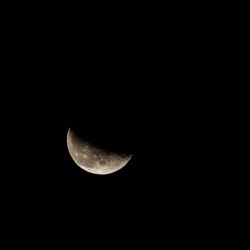 Low angle view of moon against sky at night