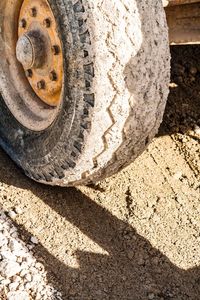 Close-up of tire on sand