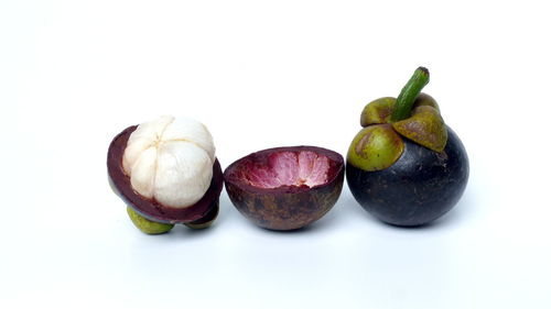 High angle view of fruits against white background
