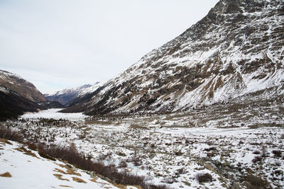 Scenic view of mountains against sky during winter