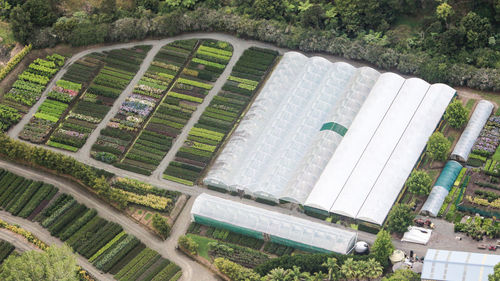 Aerial view of greenhouse and field