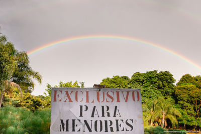 Information sign against trees