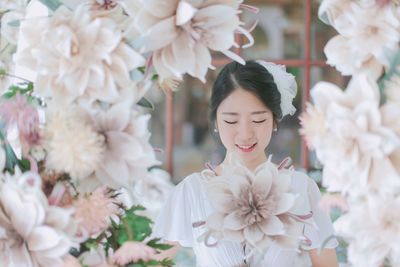 Smiling young woman with eyes closed