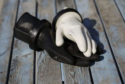 Close-up of hand on table