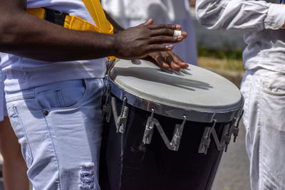 Atabaque drum player in the streets of brazil during brazilian samba presentation