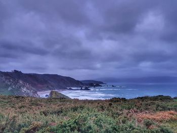 Scenic view of beach against sky