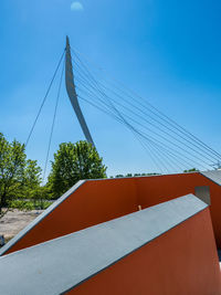 Low angle view of bridge against clear blue sky