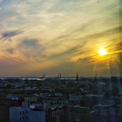 Cityscape against sky during sunset