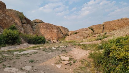 Rock formation on land against sky