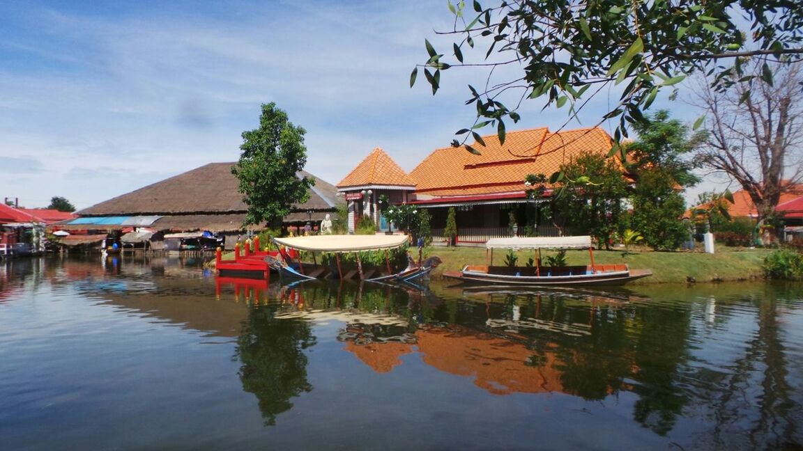 water, built structure, architecture, waterfront, building exterior, tree, sky, nautical vessel, house, lake, moored, boat, reflection, river, transportation, mode of transport, canal, cloud, rippled, day