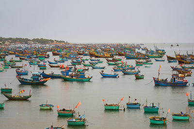 Boats moored at harbor