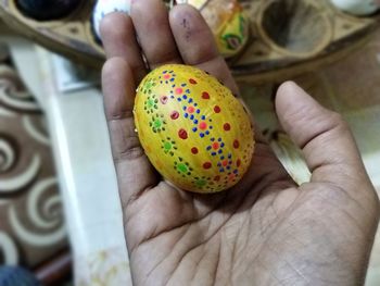 Close-up of person hand holding eggs