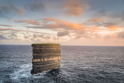 Sea stack downpatrick head standing in atlantic ocean, ireland