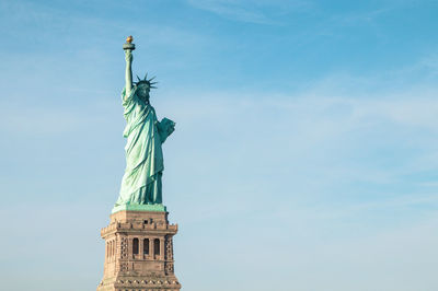 Low angle view of statue against sky