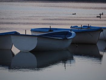 Boats moored in sea