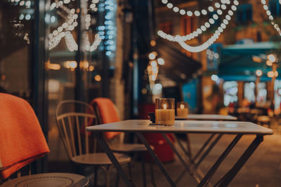 Empty chairs and tables at cafe