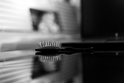 Close-up of hairbrush on table at home