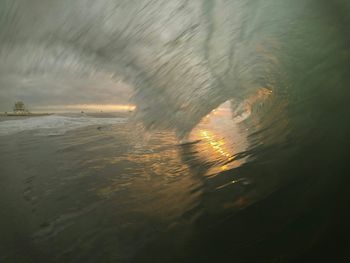 Scenic view of sea at sunset