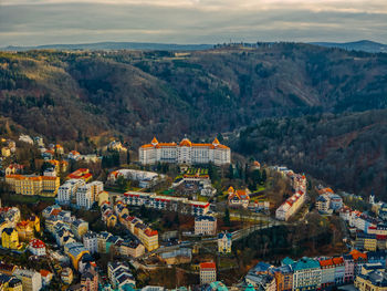 High angle view of townscape and mountains against sky