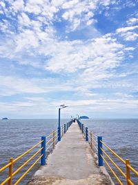 Pier over sea against sky